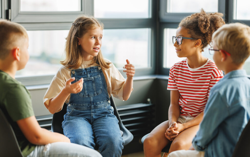 Group work of school children, discuss a collective project at school